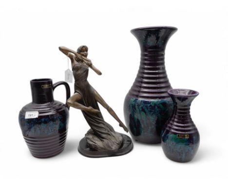 A trio of Blakeney Pottery purple and green glazed vases, together with a figure of a girl playing pan pipes Condition Report