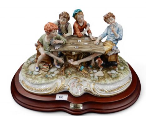 Germano Cortese for Capodimonte, a large detailed figure group of boys playing cards at a table Condition Report:Available up