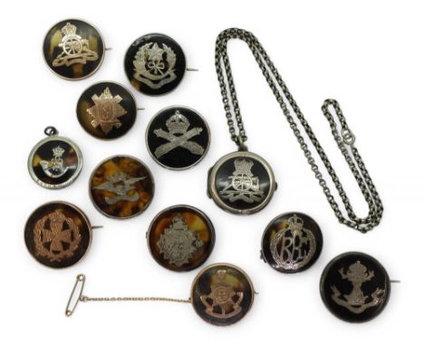 A collection of tortoiseshell regimental sweetheart brooches, comprising 9ct gold inlaid/mounted examples for the Royal Susse