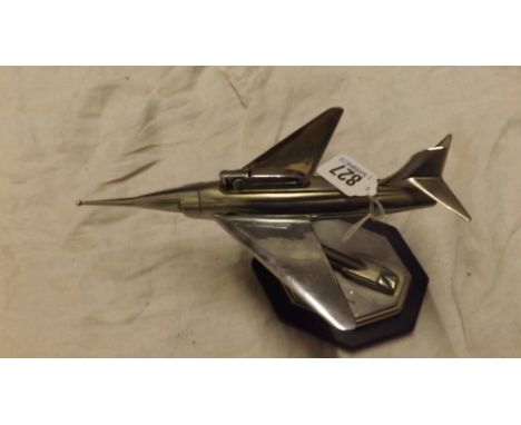 Chrome cigarette lighter in the form  of a plane on stand        