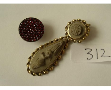 Lava cameo pendant and a garnet button    