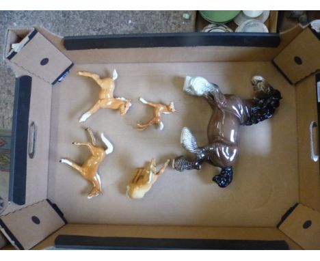 A collection of Beswick horse figures to include a brown cantering shire together with 3 palomino foals and a similar Goebel 