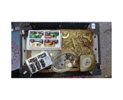 A mixed collection of items to include horse brasses, modern pocket watch, silver plated small tray, dressing table clock etc