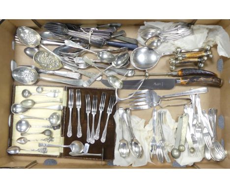 A collection of loose and cased cutlery to include meat knife and fork, spoons, etc 