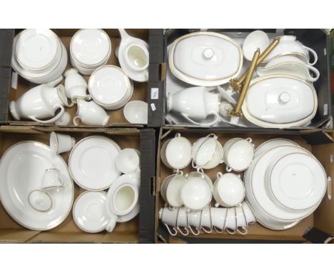 A large collection of unmarked tea and dinner ware with gold rim to include teapot, coffee pot, saucers, side plates, tureens