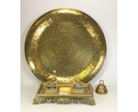 A Victorian Brass Inkstand with Glass Inkwells together with a Large Eastern Tray and Bell. Length of Inkwell: 29cm 