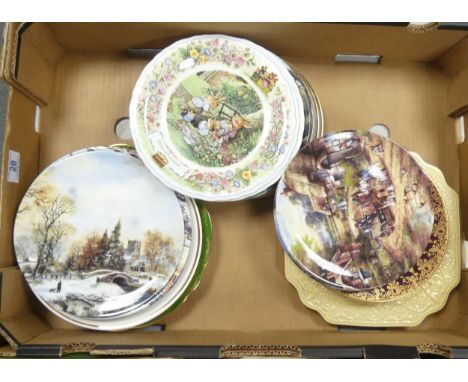 A collection of decorative wall plates to include Crown Devon cries of London, Danbury Mint examples, etc ( 