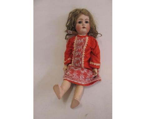 A Kammer &amp; Rheinhardt bisque head walking doll with cry, brown glass sleeping eyes, open mouth and teeth, brown mohair wi