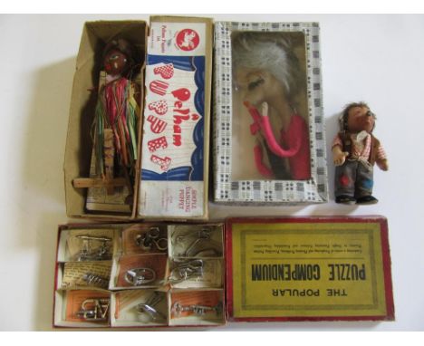 A Pelham string puppet "Mambo" in box with blue/pink label, a "Popular Puzzle Compendium" 9 metal puzzles, box AF, a Steiff h