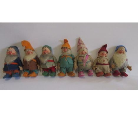 Seven Dwarfs (no Snow White), possibly Chad Valley, in cotton fabric with felt hats and boots, moulded painted faces, 9" high