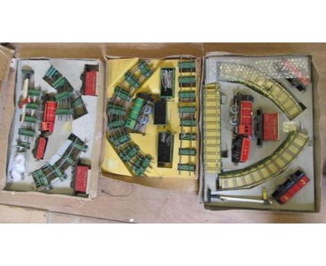 Three Chad Valley Clockwork Train Sets with 0-4-0 locomotives, goods trucks, passenger coaches and track, all boxes AF, F-G (