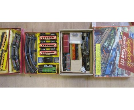 Three clockwork train sets by Mettoy, Brimtoy and one empty Mettoy box, boxes AF, F-G (Est. plus 21% premium inc. VAT)