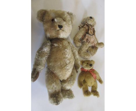 A Chiltern "Hugmee" teddy bear, mid 20th century, with swivel joints, pale gold plush, black/amber eyes, sewn nose, velvet pa