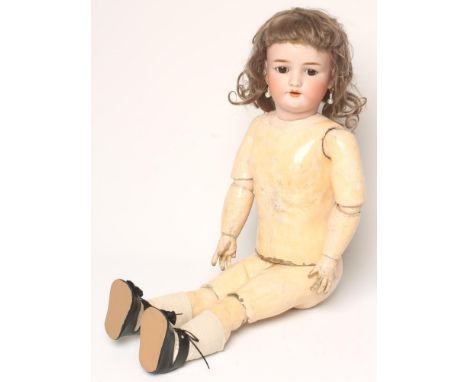 A Heinrich Handwerck bisque head doll with brown glass sleeping eyes, open mouth and teeth, pierced ears, brown mohair wig, o