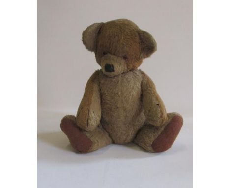 A Chad Valley "Cubby" teddy bear, with swivel head and arms, two colour beige plush, black/amber eyes, sewn nose, felt pads, 