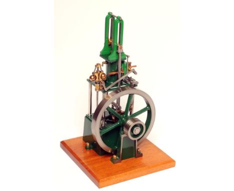 A Stuart-James Coombes kit built table engine comprising single cylinder with operating ball regulator, finished in green on 