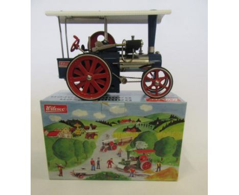A Wilesco traction engine, as new, never steamed, boxed, M, a small wood box of Wilesco/Mamod tools, and "Toy Steam Engines" 