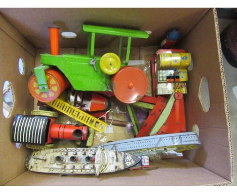 A Mettoy clockwork steam roller with novelty motion, 12" long, a clockwork station trolley with porter and luggage, a Ubilda 