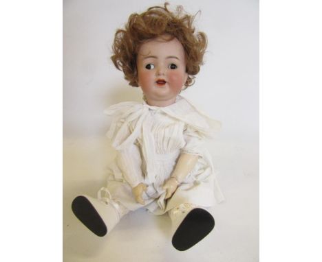 A Kammer &amp; Reinhardt bisque head character doll, with brown glass flirty eyes, open mouth, teeth and tongue, later wig, c