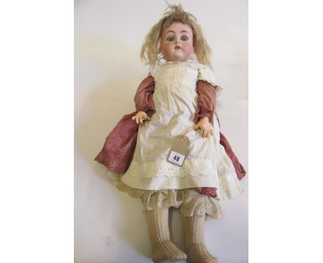 A Simon &amp; Halbig K &amp; R bisque socket head doll, with blue sleeping glass eyes, blonde wig, open mouth and teeth, pier