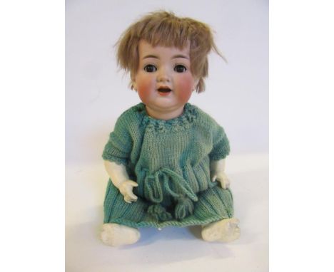 A Kammer &amp; Reinhardt bisque head character doll with brown glass flirty eyes, open mouth, teeth and tongue, fair mohair w