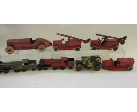 Three Chad Valley tinplate fire engines (only two ladders), an English racer, a camouflaged van, and two locomotives by Chad 