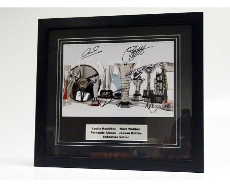 Formula One Signed Colour Photograph  A rare piece of F1 memorabilia, unusually featuring the signatures of five F1 personali