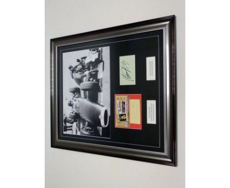 Graham and Damon Hill Signed Photographic Presentation  A striking and highly-evocative large-format photograph depicting Gra