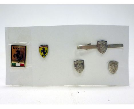 Ferrari Ephemera  Comprising a pair of 'prancing horse' cufflinks, a similar tie-slide, together with two lapel badges. (5)