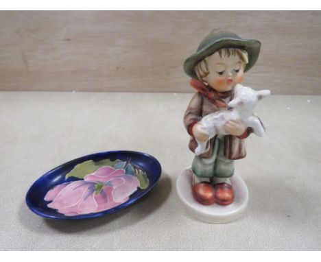 A MOORCROFT MAGNOLIA PATTERN PIN DISH TOGETHER WITH A GOEBEL FIGURE (2)