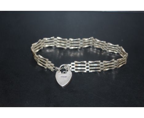 A VINTAGE SILVER GATE BRACELET WITH HEART PADLOCK