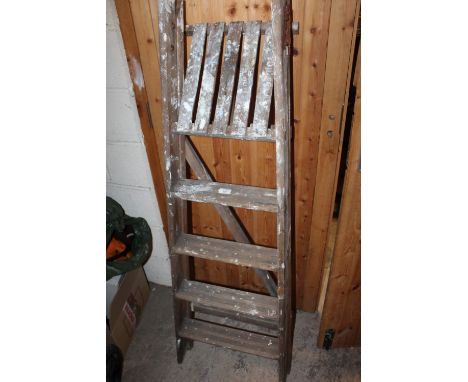 A SET OF VINTAGE WOODEN STEP LADDERS