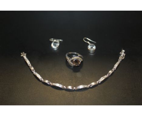 A STERLING SILVER GEMSET DRESS RING, EARRINGS AND A BRACELET