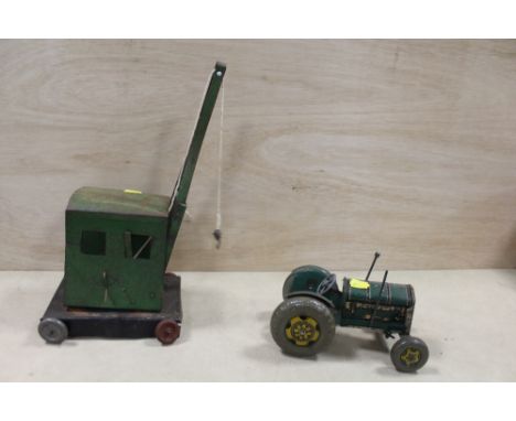 A VINTAGE TINPLATE TRACTOR TOY TOGETHER WITH A VINTAGE TINPLATE CRANE