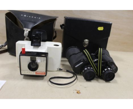 A VINTAGE POLAROID SWINGER MODEL 20 CAMERA TOGETHER WITH A PAIR OF MIRANDA 10 X 50 BINOCULARS