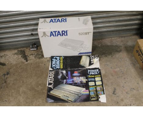 A BOXED ATARI 520ST GAMES CONSOLE 'POWERPACK' COMPLETE WITH 20 TITLES ENTERTAINMENT SOFTWARE, OWNERS MANUAL, MOUSE AND POWER 