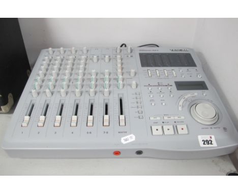 Tascam Model 564 Digital Portastudio Mixer Recorder, can record up to four tracks simultaneously on MD date disks (untested).
