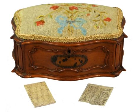 A 20th century French walnut jewellery casket of serpentine form with applied scrolling mouldings to the front, sides and can