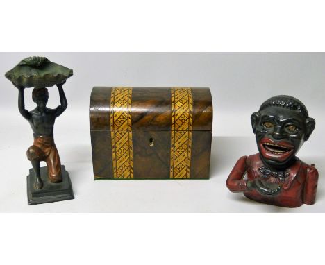 A cast-iron mechanical money box in the form of a bust of a black man wearing a red jacket, 16cm high, a cold painted metal t