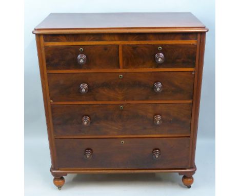 A Victorian mahogany chest of two short and three long graduated drawers with mother-of-pearl inset turned knob handles and s