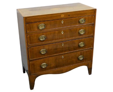 A 19th century mahogany chest of four long graduated cockbeaded drawers with satinwood banding and edging and batwing spandre