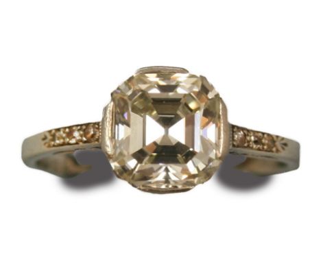 A white metal mounted single stone Art Deco diamond ring, circa 1935, claw set with an Asscher cut stone, estimated to weigh 
