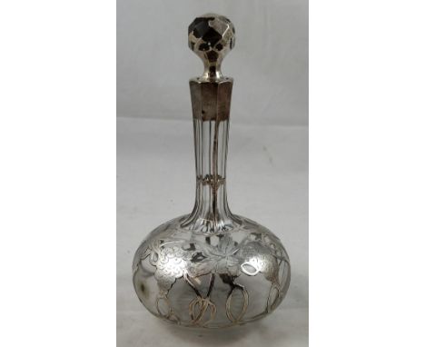 A silver overlaid glass wine flask, bearing unidentified marks of globular form, the silver engraved with grapes and vines, h