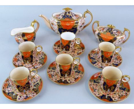 A Victorian Davenport tea set in the Imari style pattern no. 3545 comprising tea pot and cover, sucrier and cover, milk jug a