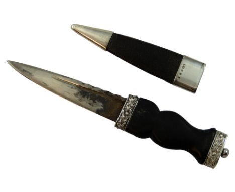 A silver and ebony sgian-dubh, by Henry Tatton, Edinburgh 1918, the carved hilt in a knotted rope design with applied silver 