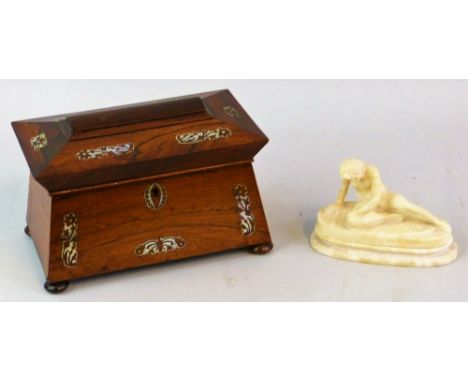 A Victorian rosewood tea caddy of sarcophagus form inlaid with mother-of-pearl fretwork motifs, the hinged lid opening to rev