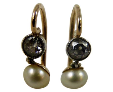 A pair of late Victorian pearl and diamond ear rings, collet set with old cut stones weighing approximately 0.25cts each with