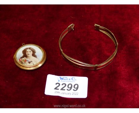A Gold bracelet, clip missing, and a rolled gold miniature portrait pendant.