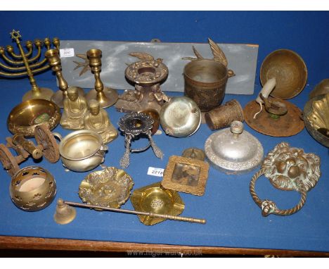 A quantity of brass and other metals including candlesticks, graduated birds on a wooden mount, Lion door knocker, cannon etc