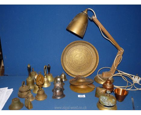 A lightweight brass angle poise lamp, novelty brass and white metal bells including Police helmets, shop bell etc.